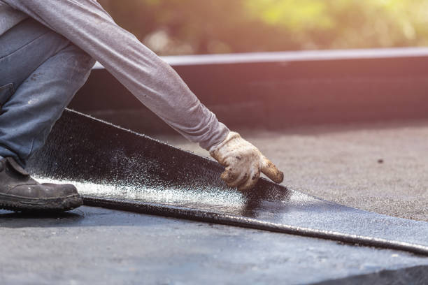 Professional Emergency Waterproofing technician working in Ellicott City, MD